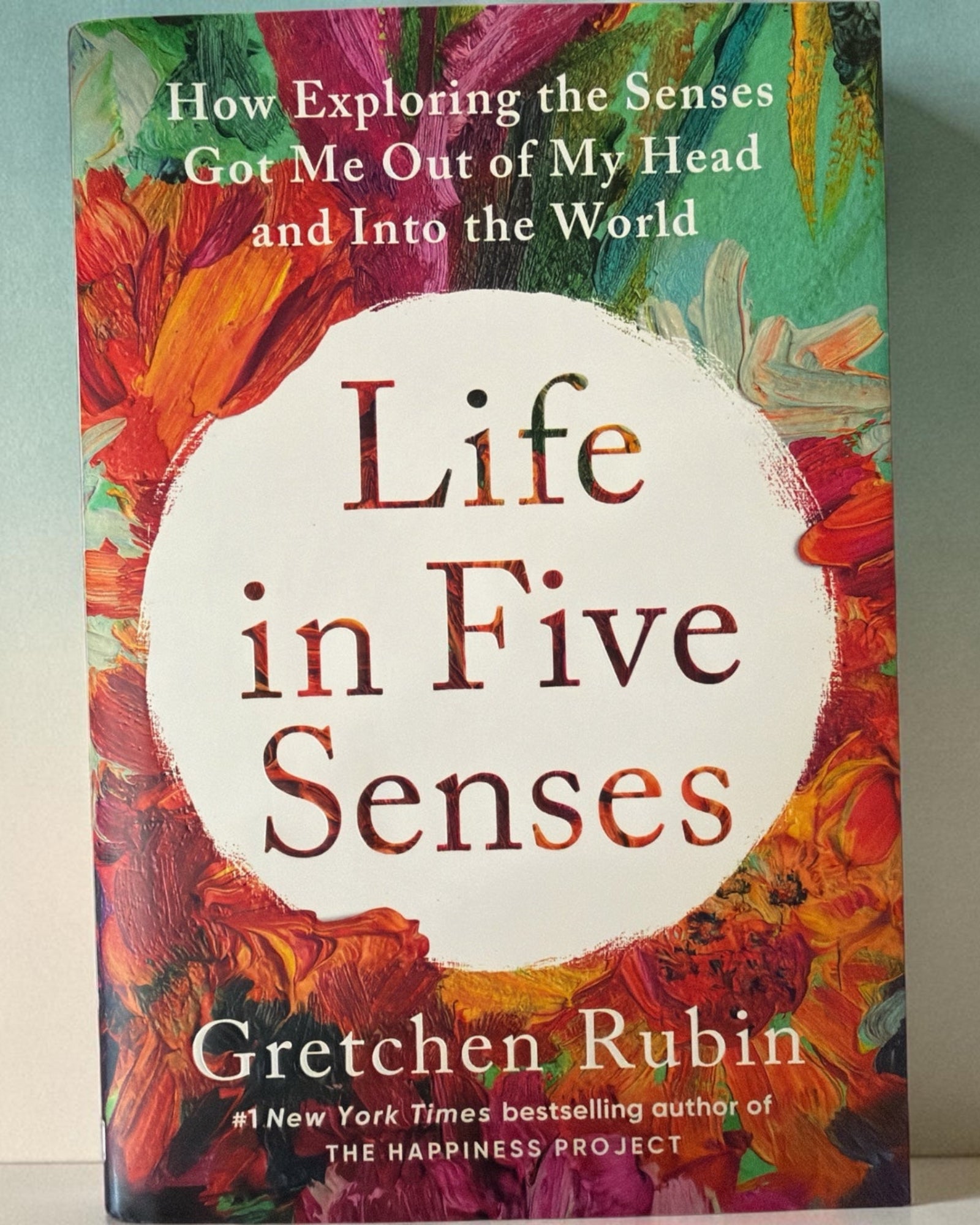 Life in Five Senses book by Gretchen Rubin with a colorful painted cover