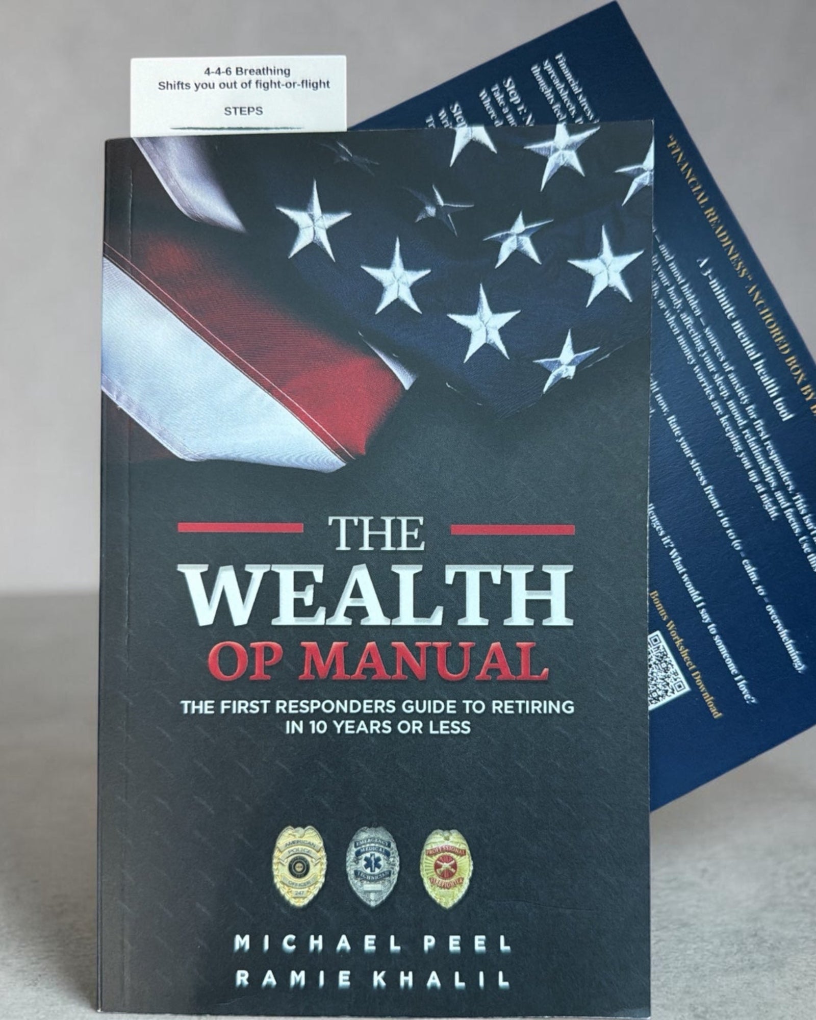 The Wealth OP Manual for first responders displayed with its included financial and stress-management tool cards