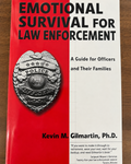 Paperback cover of Emotional Survival for Law Enforcement by Kevin M. Gilmartin, a guide for officers and their families on hypervigilance, stress, and emotional wellness.